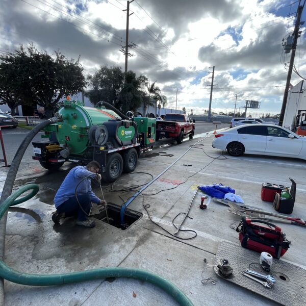 Lay It Rite crew working on a main sewer line at the street